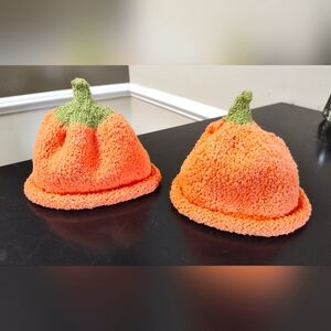 2 hand knitted pumpkin hats for baby/toddler